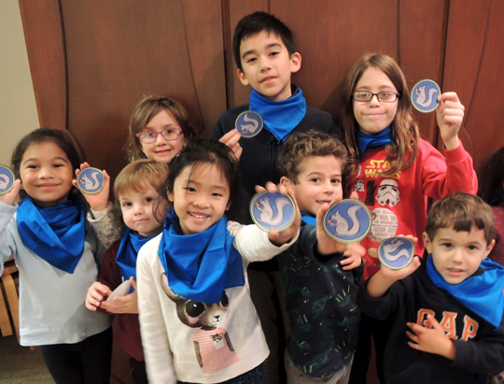 kids holding ranger badges
